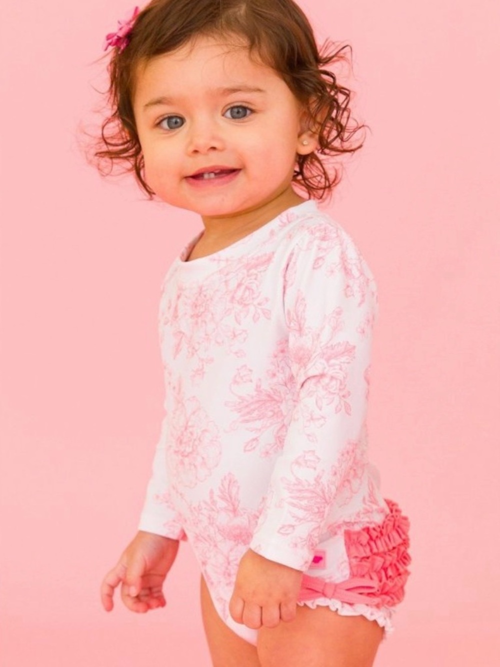 Ruffle Butts Pink Floral Long Sleeve Swimsuit with Coral Ruffle Bottoms